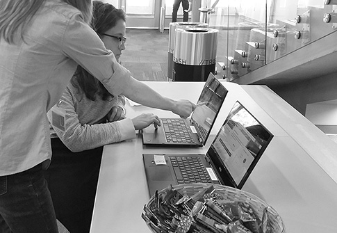 Staff conducting user testing with a student